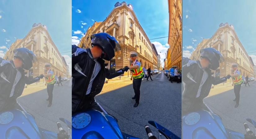 Videón, ahogy ökölpacsit ad egy rendőr a motorosnak Budapesten