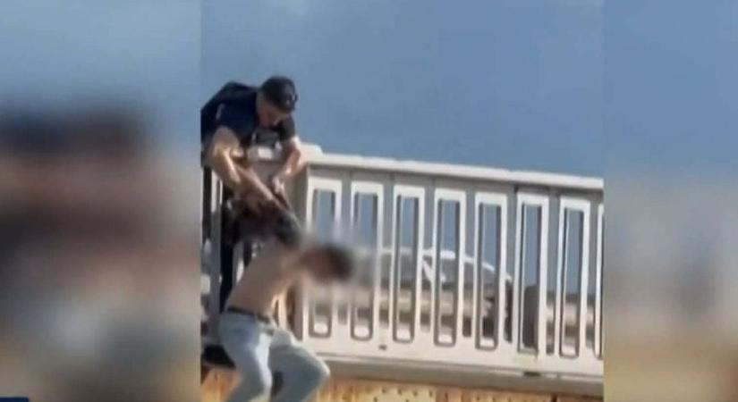 Újabb videó: Így húzták vissza a halálból a hídon őrjöngő férfit