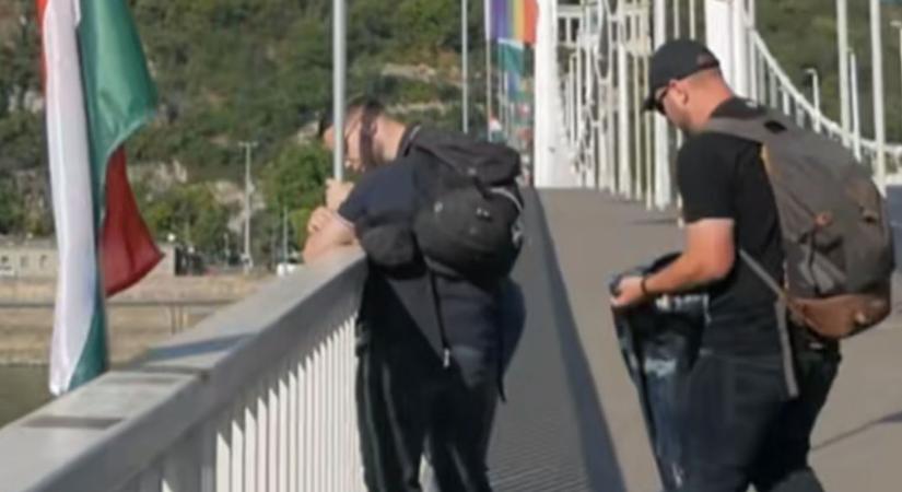 Zászlóháború a Pride előtt az Erzsébet hídon: éjjel a Dunába dobálták, ma pedig egészen a Városházáig futottak a szivárványos zászlókkal