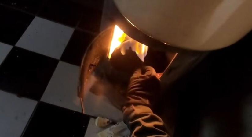 Kályhába dobta a drogot a menekülő díler, a rendőr puszta kézzel nyúlt tűzbe – videón az akció